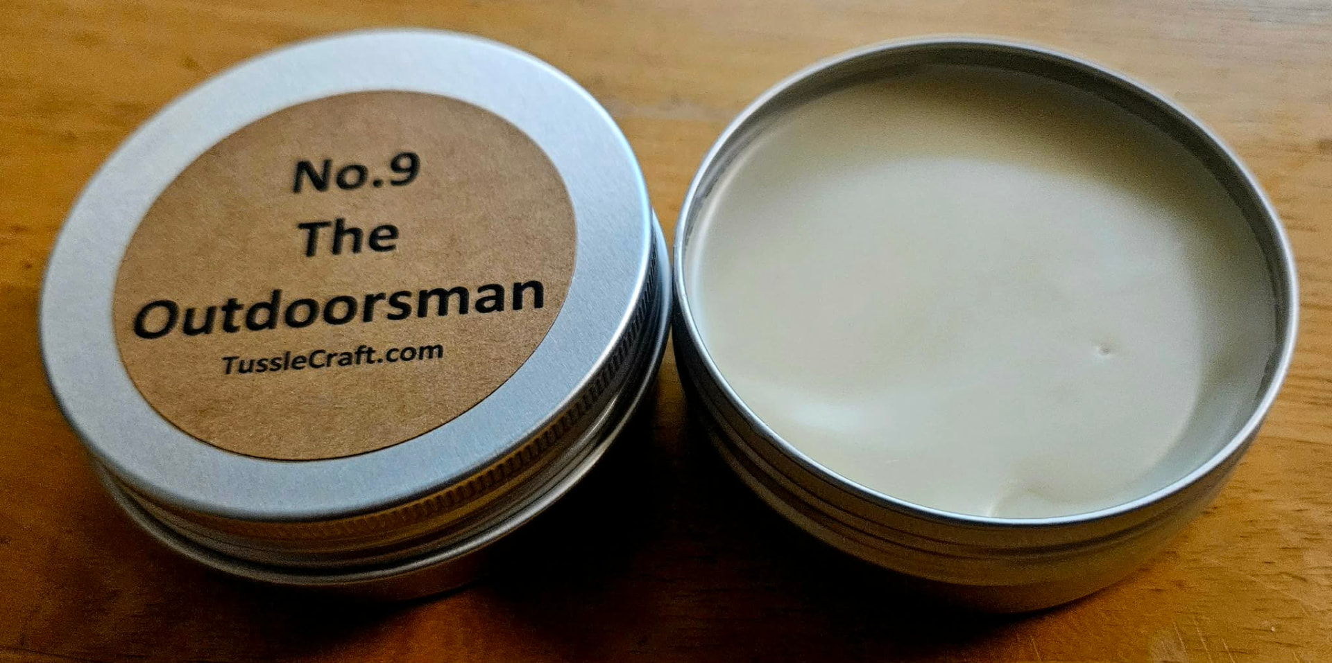 No. 09 The Outdoorsman solid botanical lotion in an open metal tin